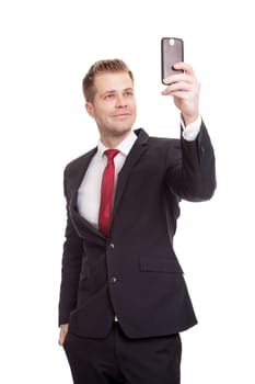 Handsome businessman taking a selfie with a mobile phone
