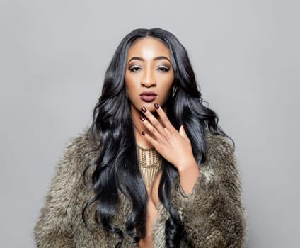 Young black beautiful woman with elegant curly hair