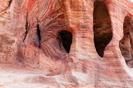 Ancient tombs carved in the rock in Petra, Jordan