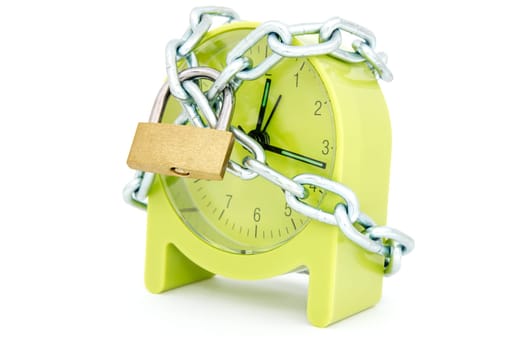 Stopping the time. Green clock with a chain and lock, isolated on white background.