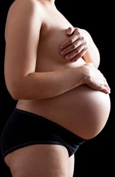 Belly of a nine month pregnant woman