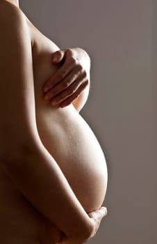 Belly of a nine month pregnant woman