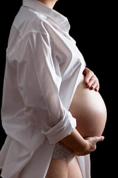 Belly of a nine month pregnant woman