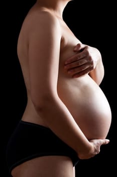 Belly of a nine month pregnant woman
