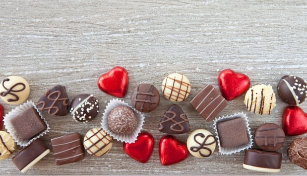 Various chocolates and chocolates on a gray background