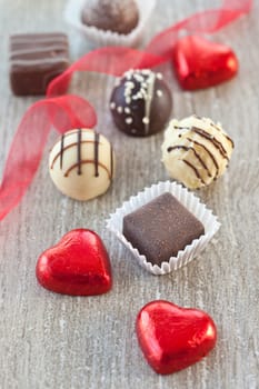 Various chocolates and chocolates on a gray background