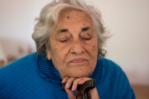 elderly thoughtful woman in the hospice