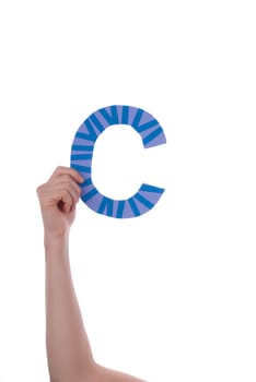 A Hand Holding a Colorful C, Isolated