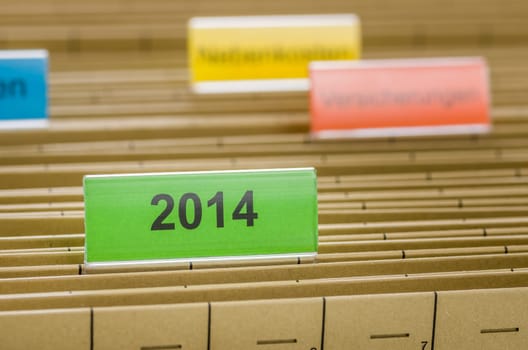 Hanging folders with the inscription 2014