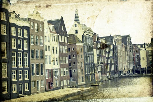 Vintage photo of traditional dutch buildings and canal, in city of Amsterdam