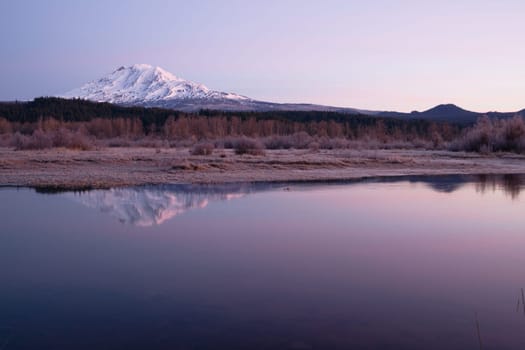 An amazing still lake scene in front of Mount Adams Washington