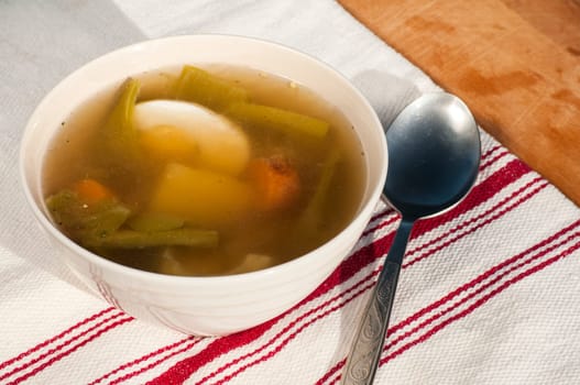 Homemade soup with meat, vegetables and boiled egg