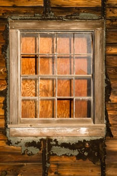 A structure photographed from the outsdie has been boarded up from the inside