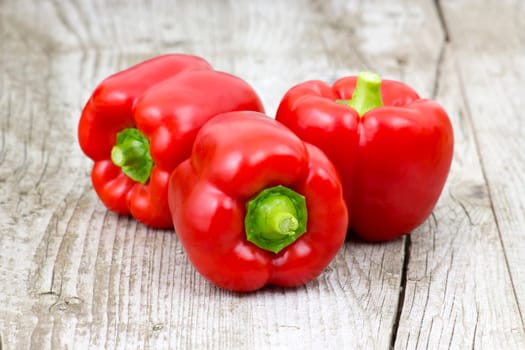 red peppers on wooden background