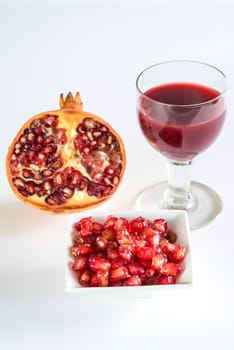 Pomegranate,halved fruit,seeds and juice