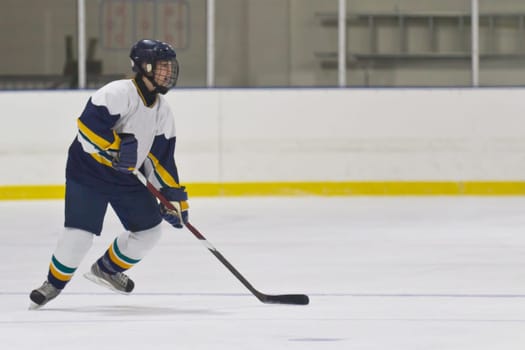 Female ice hockey player playing in a game