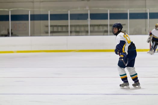 Female ice hockey player playing in a game