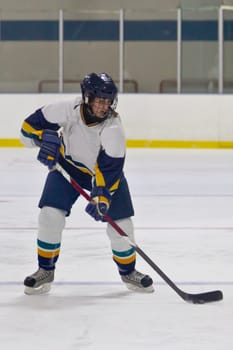 Female ice hockey player playing in a game