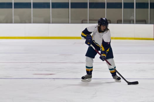 Female ice hockey player playing in a game