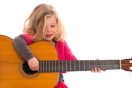 Little girl plays guitar