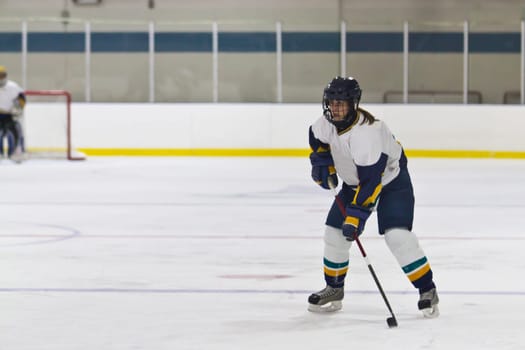 Female ice hockey player playing in a game