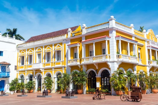 Yellow and white colonial building the historic center of Cartagena, Colombia