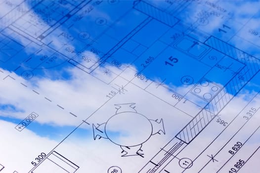 Sky with clouds and the floor plan of a house blueprint.