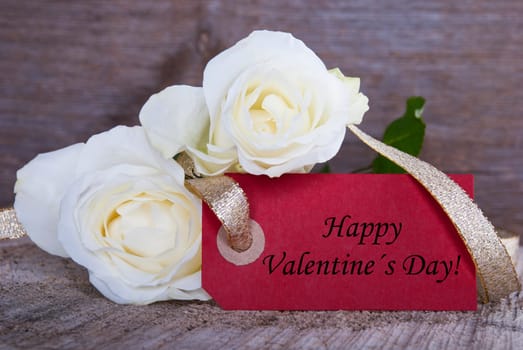 A Red Label with Happy Valentines Day and white Roses