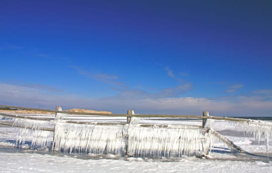 Icicle on a wooden fence on the Baltic Sea,Western Pomerania Lagoon Landscape National Park,Darss,near Prerow,Mecklenburg-Western Pomerania,Germany