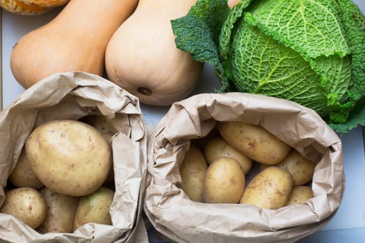 Potatoes, cabbage and butternut squash in drawer.