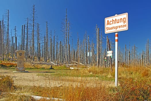 Sign "Achtung Staatsgrenze"" at the border triangle of Germany,Austria,Czech Republic,Bavarian Forest,Sumava National Park"
