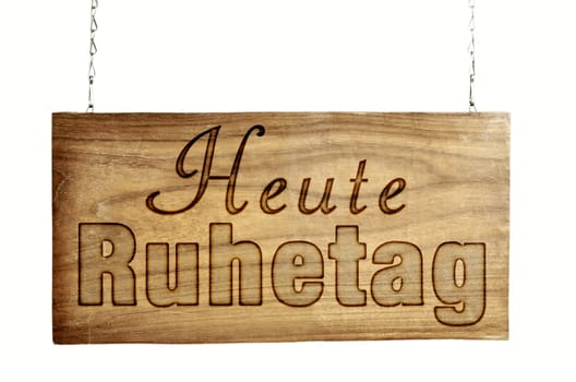 Wooden door sign hangs chain