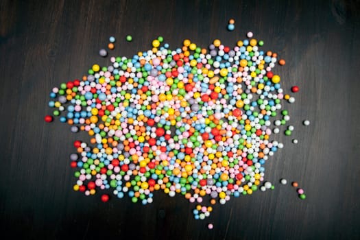 Color balls on wooden background