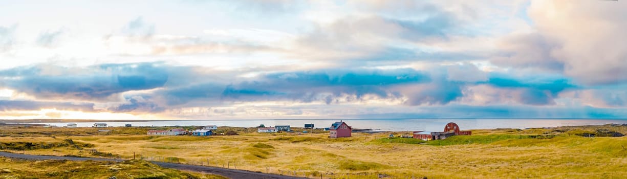 Icelandic landscape with volcanic rocks and green grass