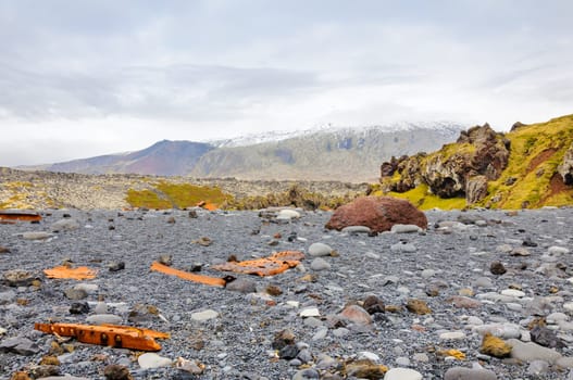 Remains of a boat wreck at the black beach on Iceland Snaefellsnes Dritvik