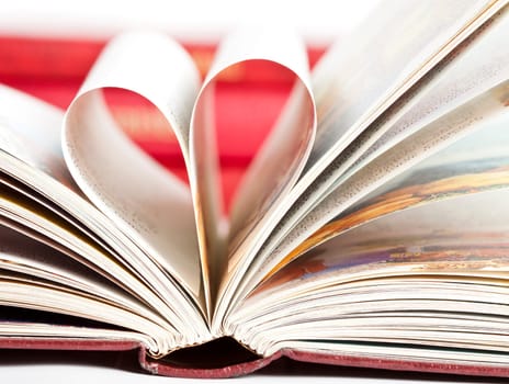 Close up on heart shaped book pages