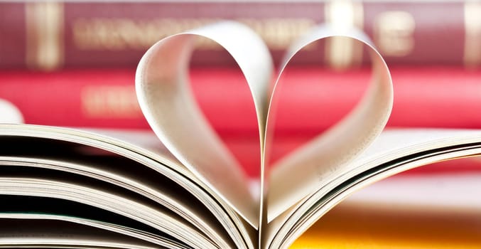 Close up on heart shaped book pages