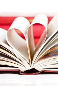 Close up on heart shaped book pages
