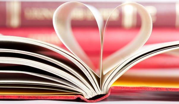 Close up on heart shaped book pages