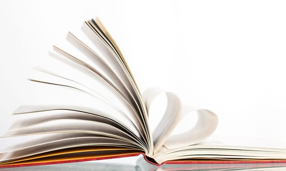 Close up on heart shaped book pages