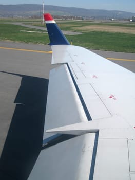 stock pictures of airplanes on the ground in an airport.