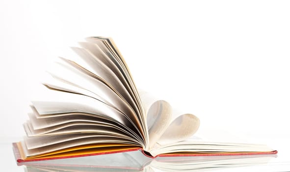 Close up on heart shaped book pages