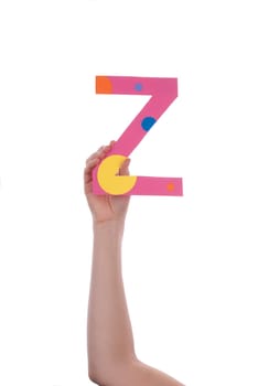 A Hand Holding a Colorful Z