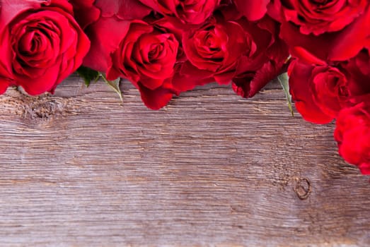 A Wooden Background with Copyspace, Framed with Roses