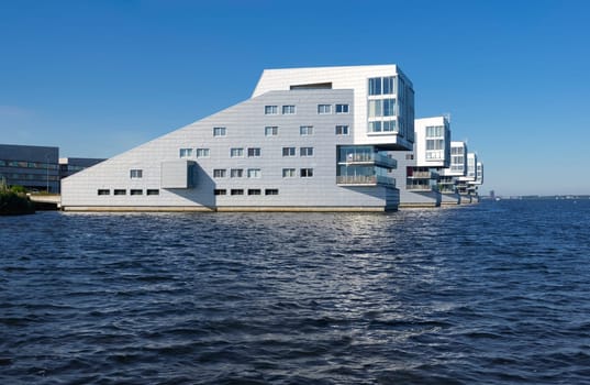 modern apartments at a lake shore in the netherlands