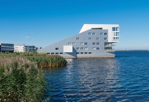 modern apartments at a lake shore in the netherlands
