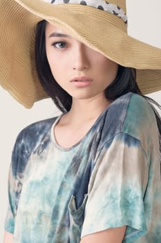 Glamour of Asian beauty with hat, closeup portrait.