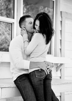 Outdoor photo of trendy young couple embracing
