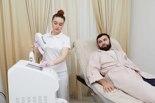 Embracing cutting-edge techniques, a man's face is treated with laser hair removal at a contemporary cosmetology clinic