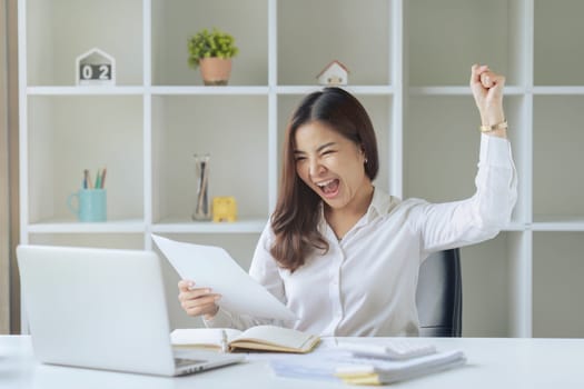 Excited businesswoman feels happy celebrating success promotion result.